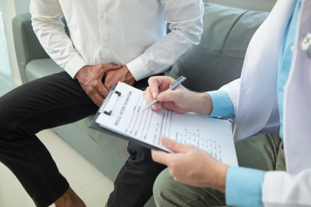 Male patient attending a follow-up appointment with a consultant urologist at a urology clinic